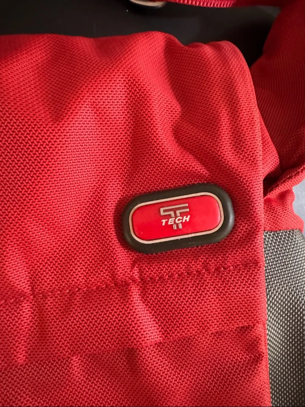 Tumi Red Messenger Bag with Gray Accent. Expandable. Laptop section.